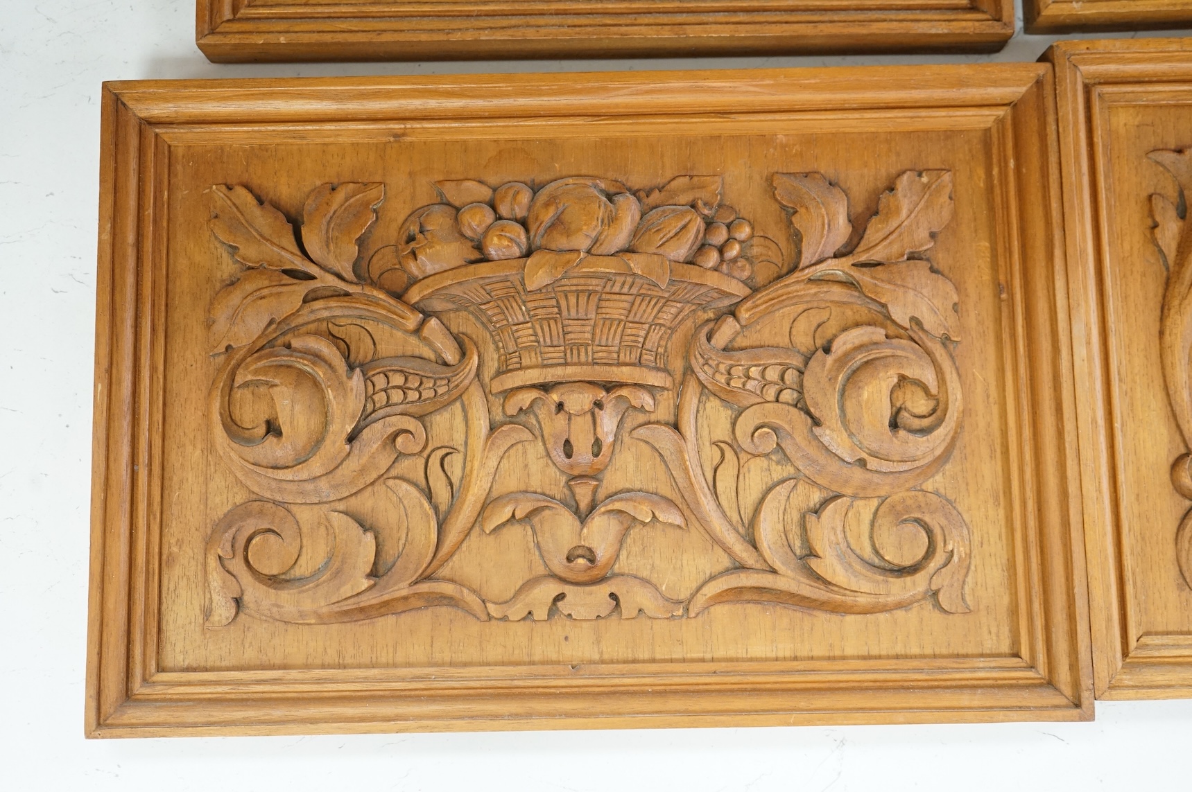 Six carved wood relief plaques, largest 31x46cm